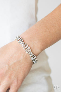 Twists and Turns - White Rhinestone Bracelet Paparazzi Accessories