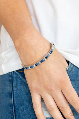Toast to Twinkle - Blue Rhinestone Hinge Bracelet Paparazzi Accessories