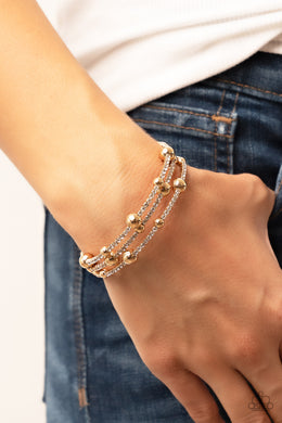 Spontaneous Shimmer - Gold Coil Bracelet Paparazzi Acessories